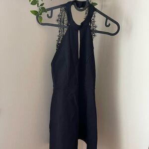 Black halter dress with lace detailing on the back
Size: S